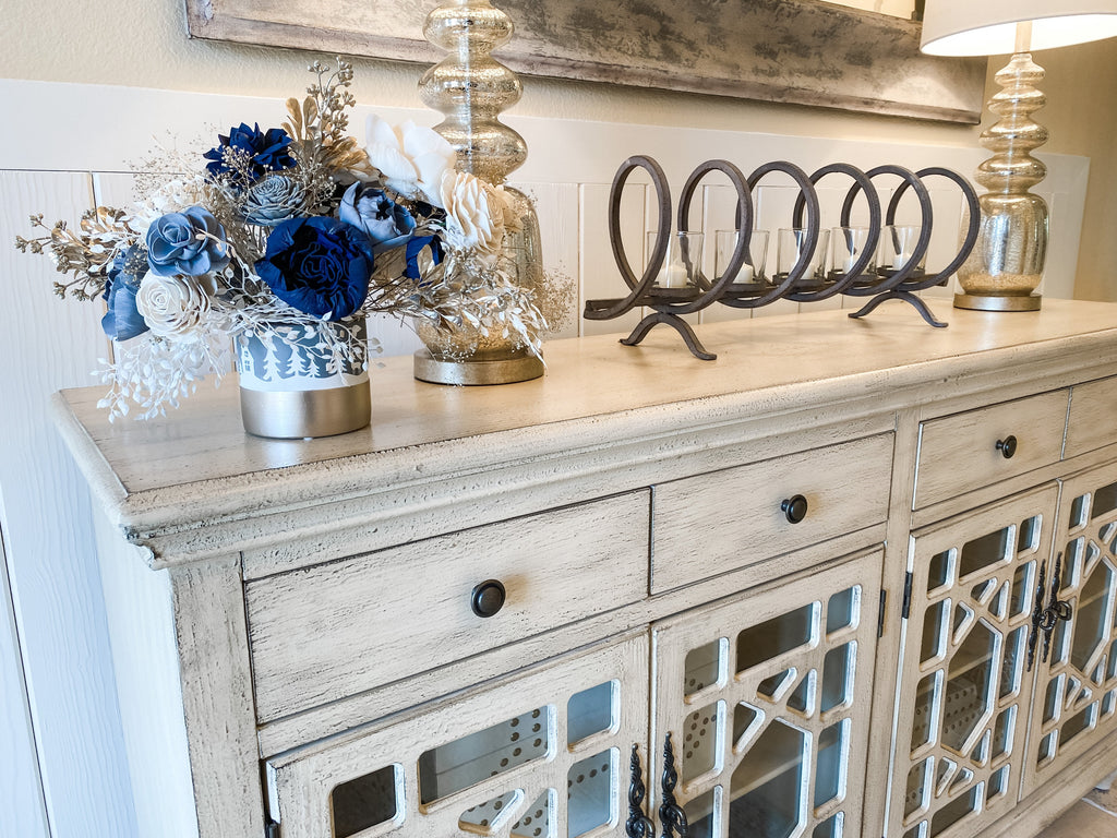 farmhouse flower arrangement in white, champagne and blue for winter 