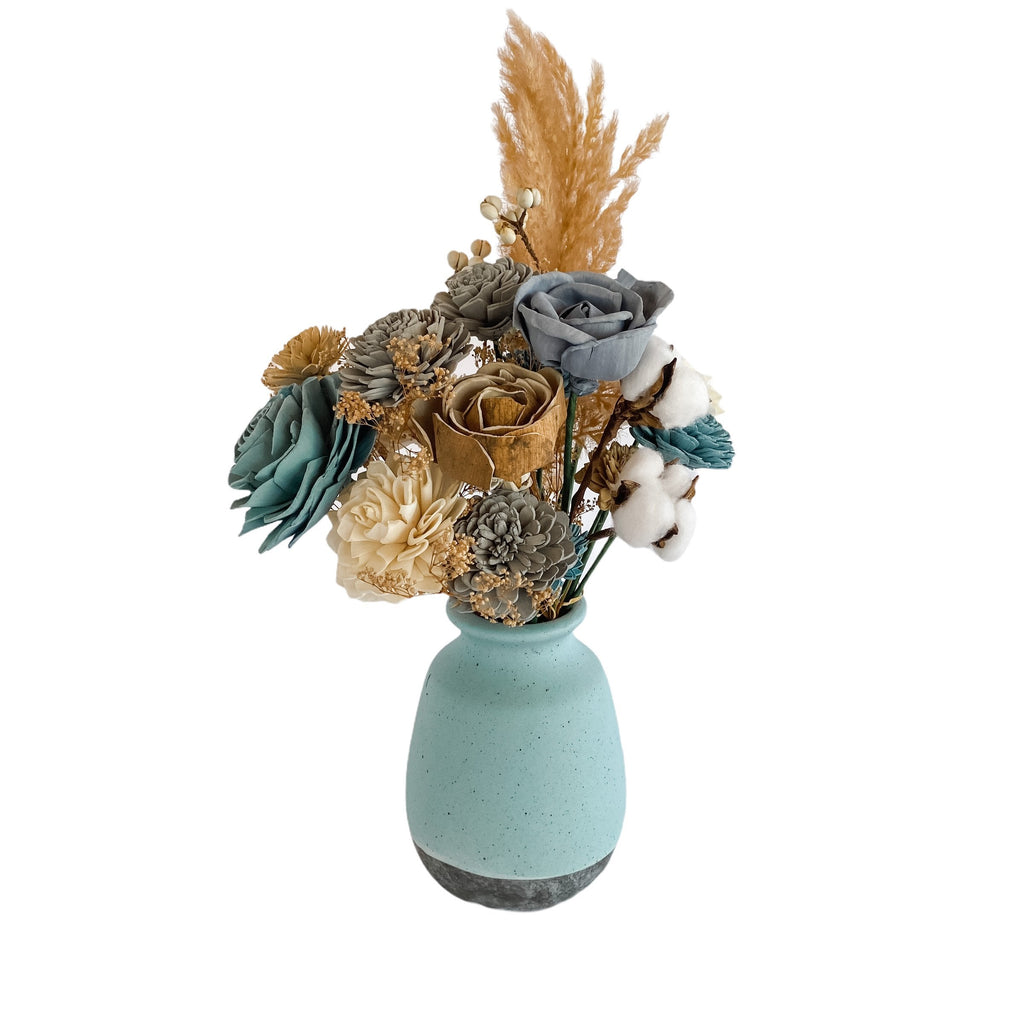 modern sola wood flower arrangement with blues and pampas grass